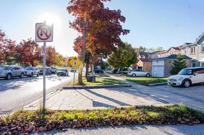a no parking sign on the side of a street at Adorable 3 Bedroom Apartment with Free Parking in Ajax