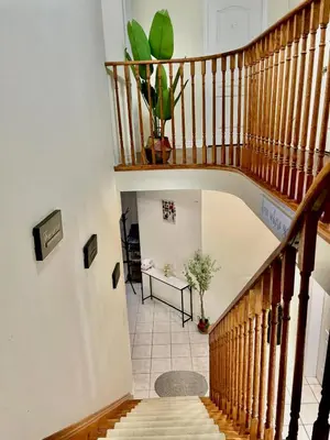 a staircase in a house with a potted plant at Extended Stays Home in Markham