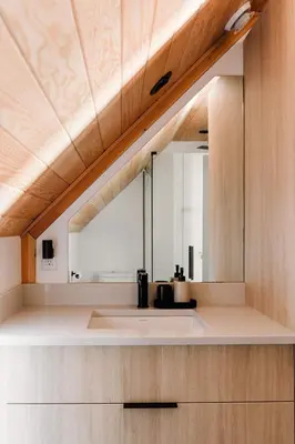 a bathroom with a sink and a mirror at Camp Haliburton - Waterfront A-Frame in Wilberforce