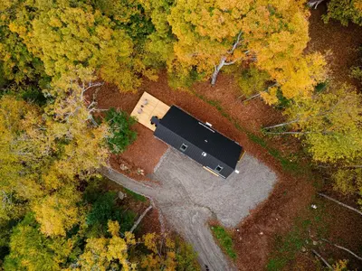 an overhead view of a barn in the middle of a forest at Camp Haliburton - Waterfront A-Frame in Wilberforce