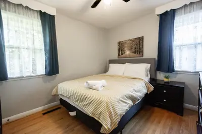 a bedroom with a bed with a stuffed animal on it at Charming 4BR Barrie Retreat with Backyard in Barrie