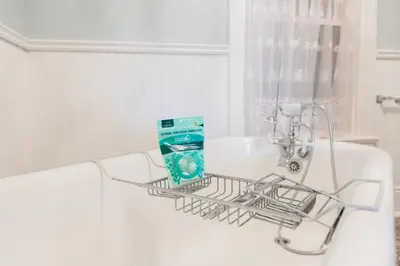 a dish drying rack on a sink in a bathroom at Barrie Bliss 3BR Haven near Centennial Beach in Barrie