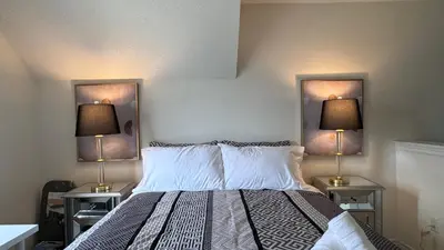 a bedroom with a bed with two lamps on the wall at 9 Queen Beds, 18 Guests-Kleinburg Luxe Crown Town Residence in Vaughan