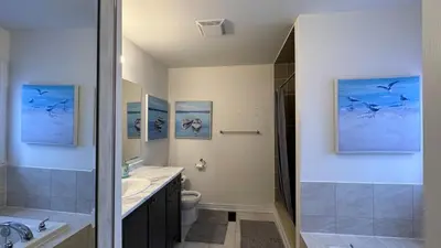 a bathroom with a sink and a toilet at 9 Queen Beds, 18 Guests-Kleinburg Luxe Crown Town Residence in Vaughan