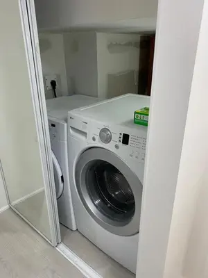 a washer and dryer in a small room at Akhtar's Residence in Mississauga