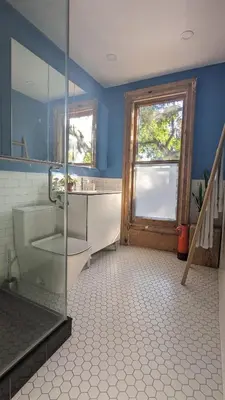 a bathroom with a shower and a glass door at Stunning Victorian in Downtown in Toronto