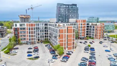 an aerial view of a parking lot in a city at Entire 1 bedroom in the heart of KW downtown across Google in Kitchener