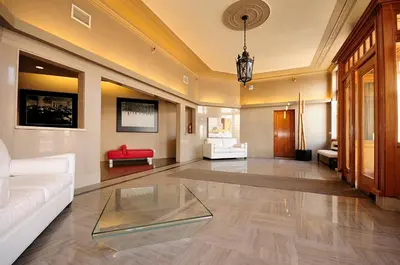 a living room with a white couch and a glass table at Entire 1 bedroom in the heart of KW downtown across Google in Kitchener