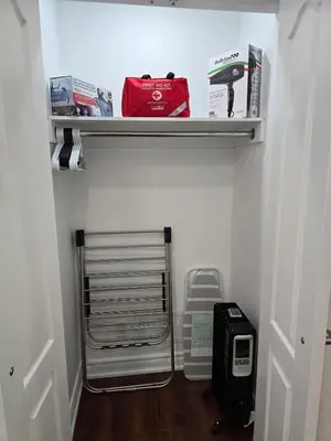 a walk in closet with a shelf with items on it at Harbour for rest in Vaughan
