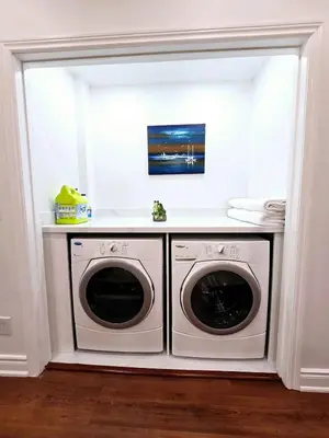 a white laundry room with a washer and dryer at Harbour for rest in Vaughan
