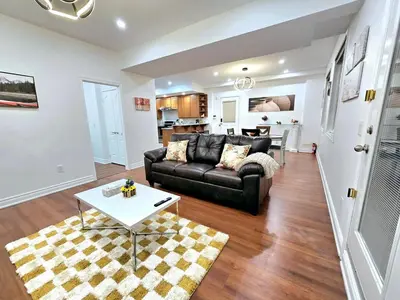 a living room with a couch and a table at Harbour for rest in Vaughan