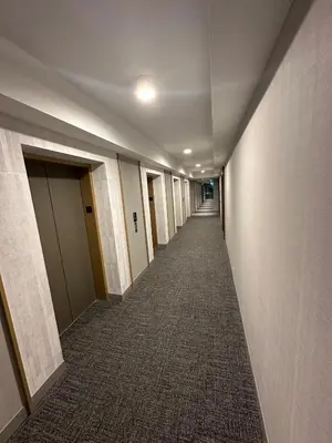 a hallway of an office building with a long corridor at The Evergreen Shelter in Vaughan