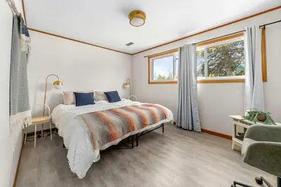 a bedroom with a bed and a window at Field of Dreams in Bloomfield
