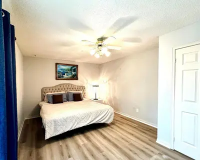 a bedroom with a bed and a ceiling fan at Cozy and spacious vacation home in Toronto in Toronto