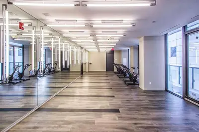 a gym with bikes lined up in a hallway at Stunning suite in downtown perfect for businesses trips and small families in Toronto
