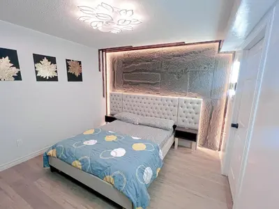 a small bedroom with a bed and a window at Private Room Near Airport D10 in Brampton