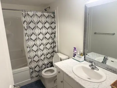 a bathroom with a toilet and a sink and a shower at LuxSpace Properties in London