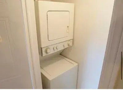 a white washer and dryer in a small bathroom at 56 Hiawatha in Woodstock