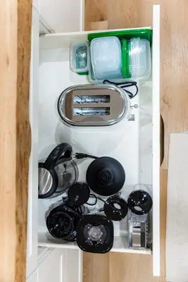 a cupboard filled with lots of kitchen utensils at The White House in Caledonia