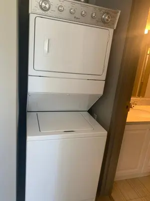 a white refrigerator with its door open in a kitchen at Sandy&Kevin#home in Waterloo