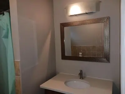 a bathroom with a sink and a mirror at Cheap Rooms in Kitchener Best For Students ,Long Term Guests in Kitchener