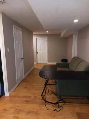 a living room with a couch and a table at Cheap Rooms in Kitchener Best For Students ,Long Term Guests in Kitchener