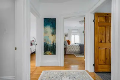 a room with a door and a painting on the wall at 3bed 2bath heritage duplex - Prime Location in Collingwood