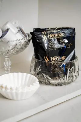a white counter with a bowl and a package of toothpaste at 3bed 2bath heritage duplex - Prime Location in Collingwood