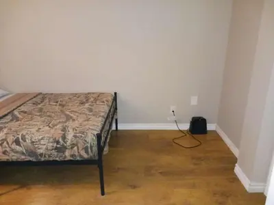a bedroom with a bed in a room at CheapSleep Room Near Kitchener Airport- 24X7 Checkin in Kitchener