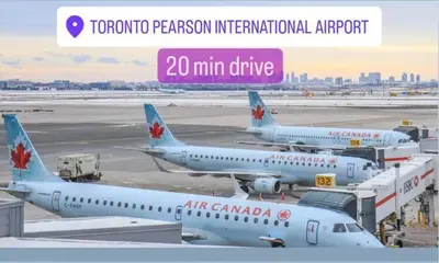 three air canada airplanes parked at an airport at Cozy Walkout Suite in Vaughan