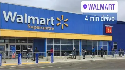 a walmart store with people standing outside of it at Cozy Walkout Suite in Vaughan