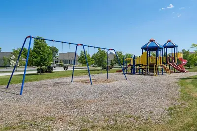a park with a playground with a slide at The Chickadee - 21 Farm View in Cherry Valley