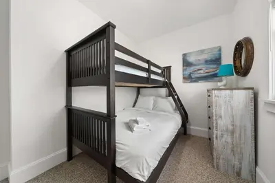 a bunk bed in a room with a bunk bed at The Sweetgrass - 57 Butternut in Cherry Valley