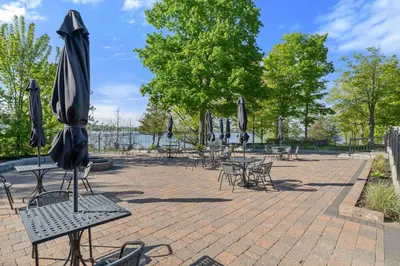 a group of tables and chairs with umbrellas at The Jack Pine - 50 Hollow in Cherry Valley