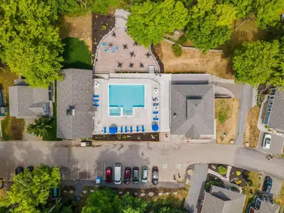 an overhead view of a building with a swimming pool at The Kiskadee - 49 Butternut in Cherry Valley