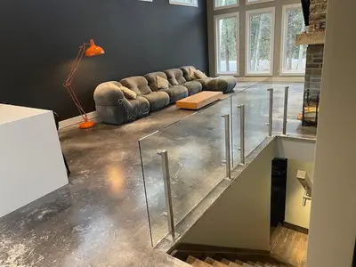 a living room with a couch and a glass floor at McCracken's Mid Century Modern Luxury Cottage in Burleigh Falls