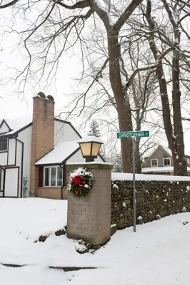 a street sign and a street light with flowers on it at Serenity on the Lake in Niagara on the Lake