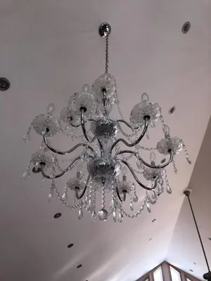 a large chandelier hanging from a ceiling at Cottage apartments at Lake Huron in Midland