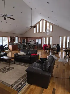 a large living room with couches and a dining room at Cottage apartments at Lake Huron in Midland