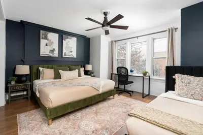 a bedroom with two beds and a ceiling fan at 1BR Apartment Near Queen West in Toronto