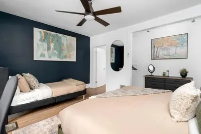 a bedroom with two beds and a ceiling fan at 1BR Apartment Near Queen West in Toronto