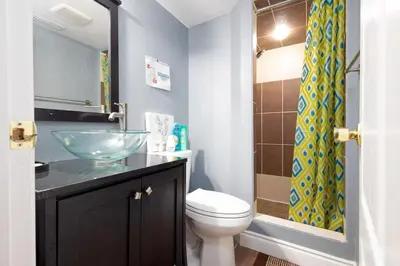 a bathroom with a sink and a toilet and a shower at Affordable Private Suite, Near Airport, Free Parking in Mississauga