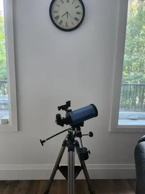 a camera on a tripod next to a clock at The Hidden Pearl in Haliburton