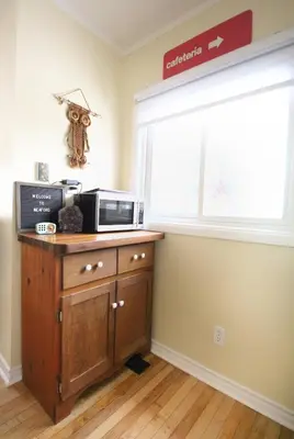 a kitchen with a microwave and a window at Sunrise and Bayview with SNOW SHOES, WATERCRAFTS , BIKES in Meaford