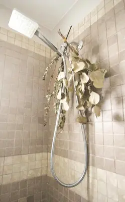 a shower head in the corner of a bathroom at Sunrise and Bayview with SNOW SHOES, WATERCRAFTS , BIKES in Meaford