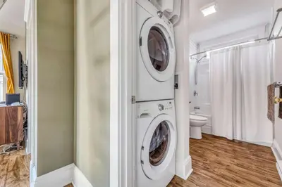 a laundry room with a washer and dryer at The Aster - 109 Butternut in Cherry Valley