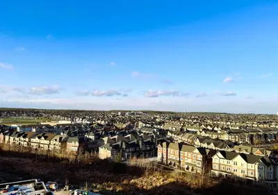 a group of houses in a residential neighborhood at Stunning new condo in Oakville in Oakville