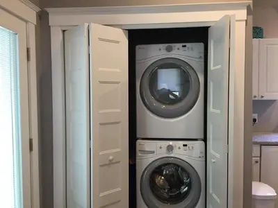 a laundry room with a washer and dryer at The Cedar - 6 Hollow in Cherry Valley