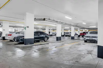 a parking lot with many cars parked in it at Luxury Spacious Apartment 10 min to Airport Wifi in Brampton
