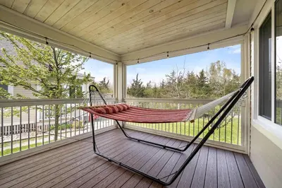 a hammock on the porch of a house at 93 Butternut in Cherry Valley
